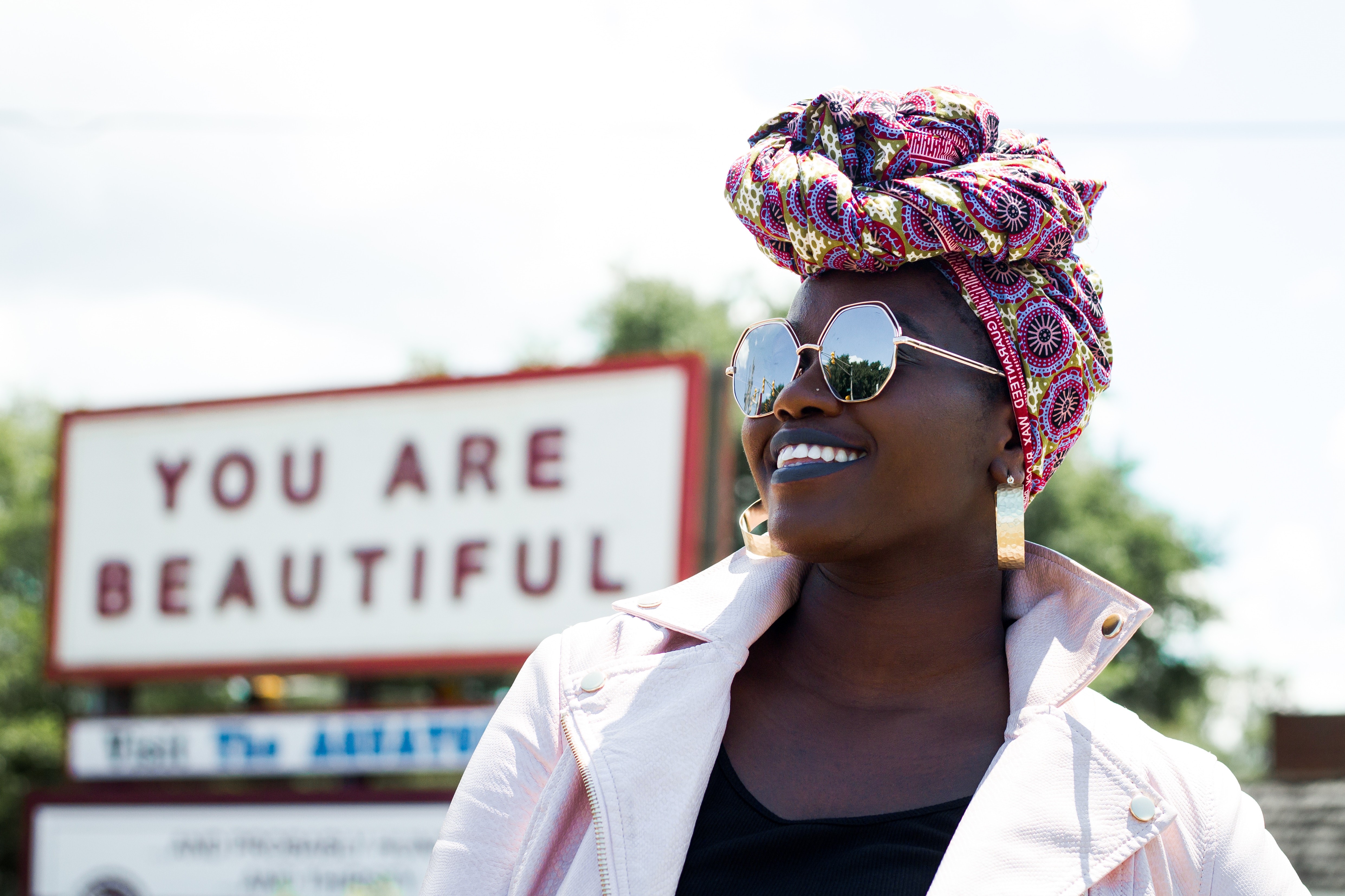 Woman with turban and sun glasses