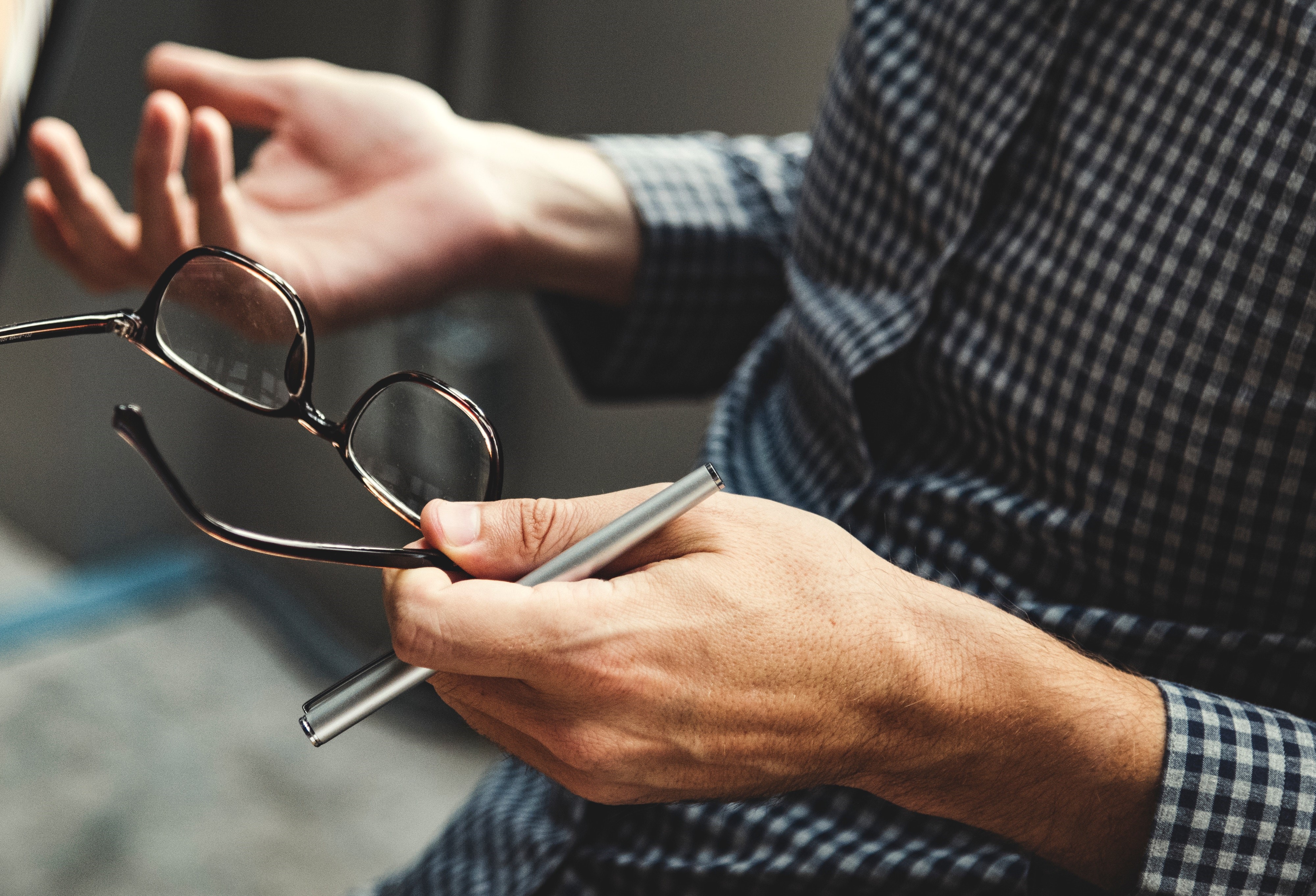 Person holding glasses
