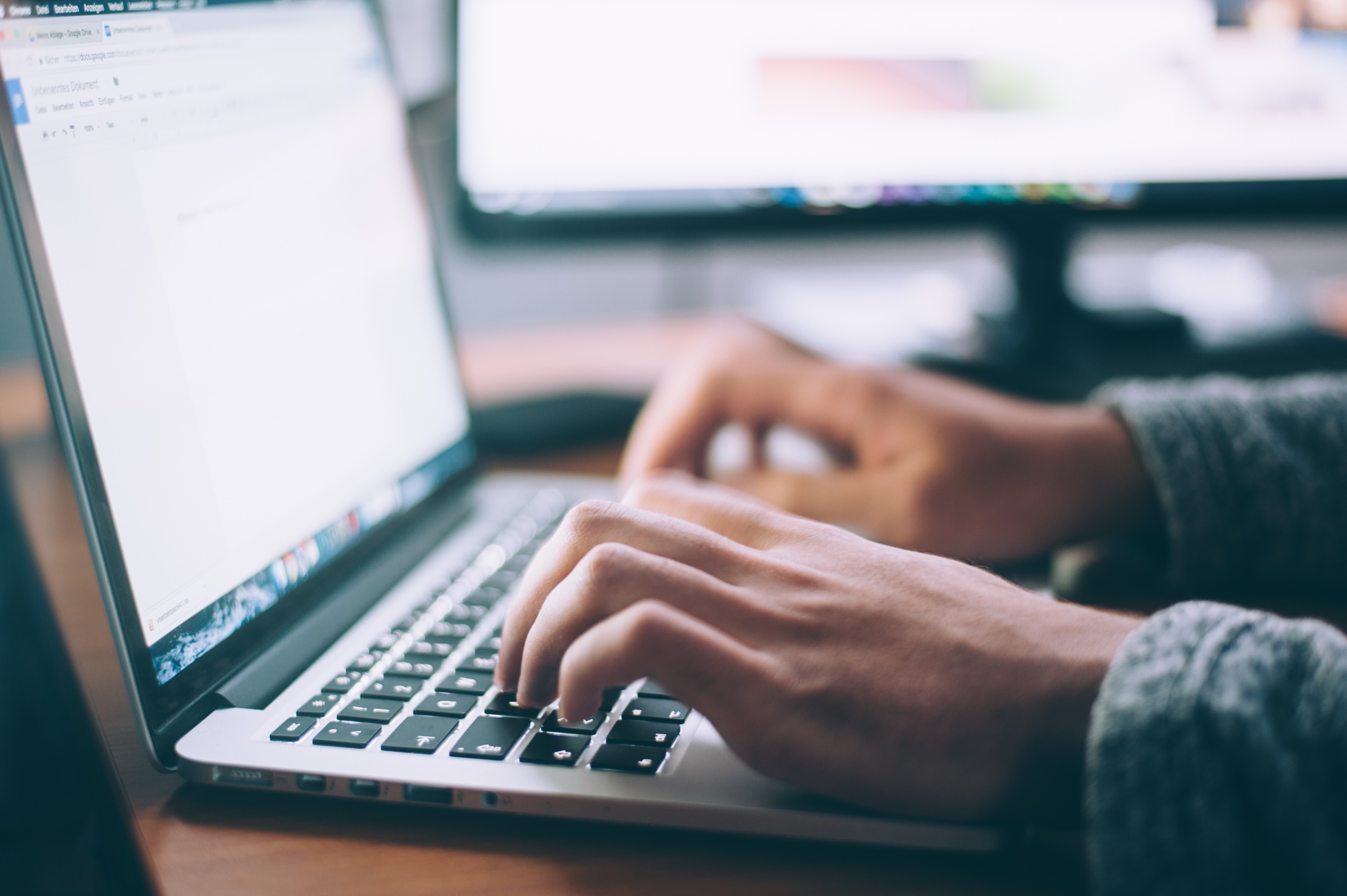 Someone typing on computer laptop